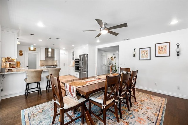 dining area featuring recessed lighting, ceiling fan, dark wood-type flooring, and baseboards