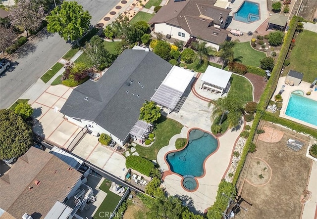 view of property location featuring a pool