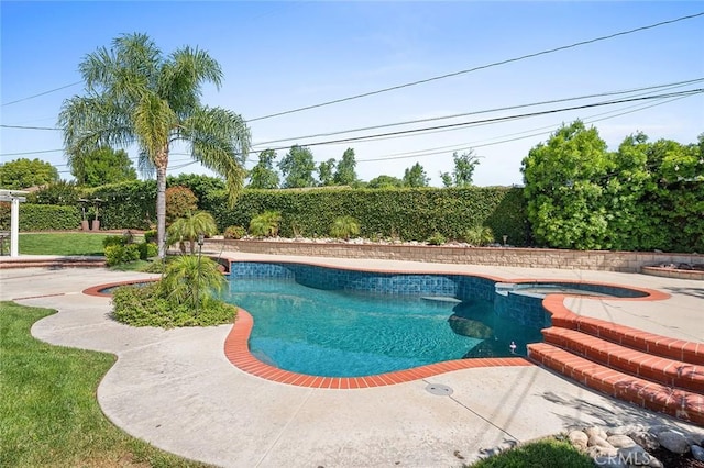 view of swimming pool featuring a pool with connected hot tub