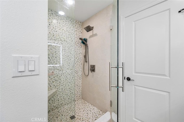 full bathroom featuring a stall shower