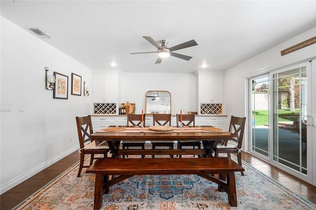 dining area with wood finished floors, a ceiling fan, baseboards, and recessed lighting