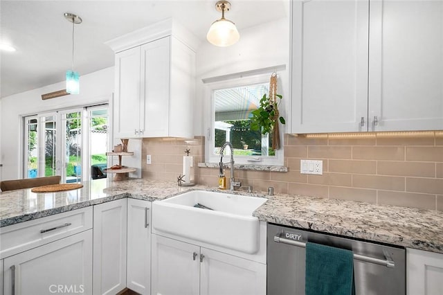 kitchen with dishwasher, a sink, white cabinetry, and backsplash