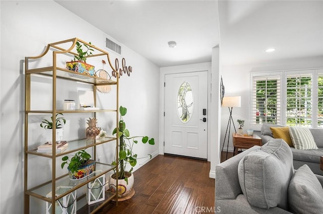 entryway with healthy amount of natural light, hardwood / wood-style flooring, baseboards, and recessed lighting