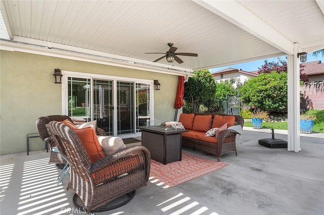 view of patio / terrace featuring an outdoor living space, ceiling fan, and fence