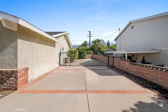 view of patio / terrace featuring fence and a gate