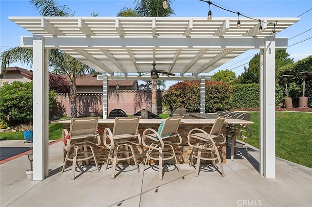 view of patio featuring a pergola and fence