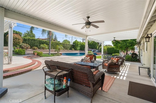 view of patio with a ceiling fan, an outdoor pool, and a fenced backyard