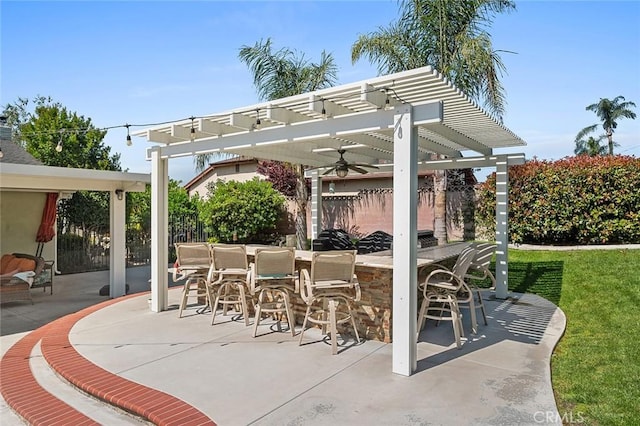 view of patio with a pergola and fence