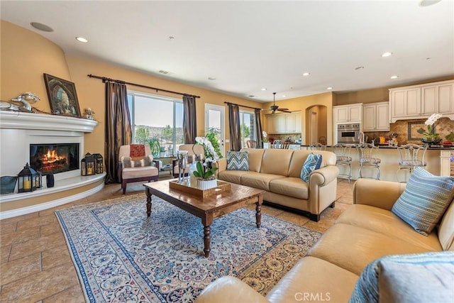 7940 Choi Dr, Riverside, CA 92506 - living area with a fireplace, recessed lighting, and a ceiling fan
