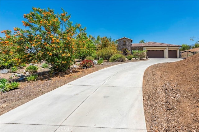 7940 Choi Dr, Riverside, CA 92506 - view of front of property featuring driveway, a tile roof, and a garage