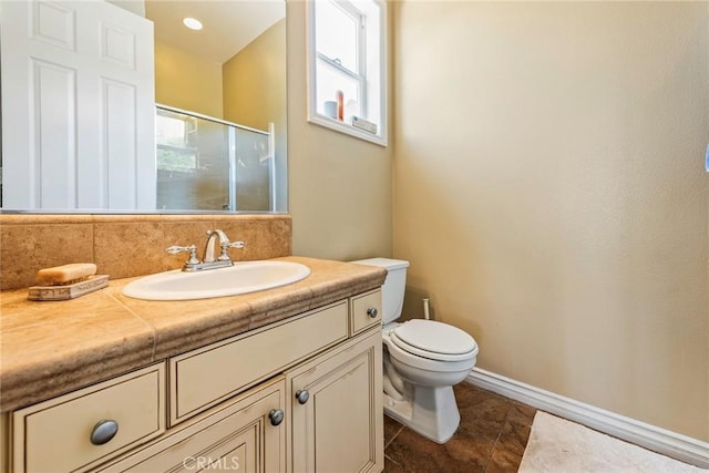 7940 Choi Dr, Riverside, CA 92506 - full bathroom featuring toilet, vanity, a shower with door, tile patterned floors, and baseboards