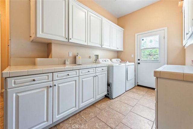 7940 Choi Dr, Riverside, CA 92506 - laundry room featuring cabinet space and washer and dryer
