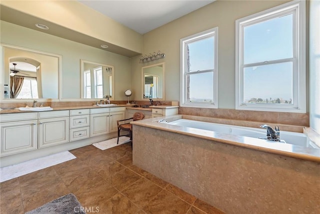 7940 Choi Dr, Riverside, CA 92506 - bathroom with double vanity, a bath, and tile patterned floors