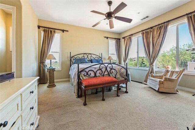 7940 Choi Dr, Riverside, CA 92506 - bedroom with light colored carpet, baseboards, and ceiling fan