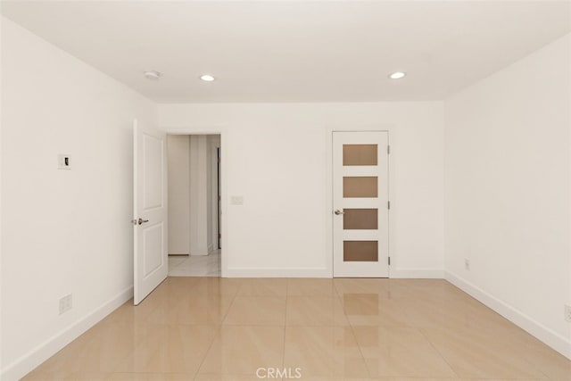 unfurnished room with recessed lighting, baseboards, a smoke detector, and light tile patterned floors