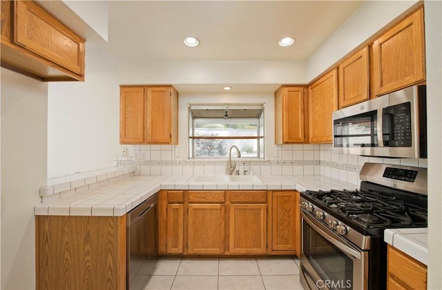 9788 Balaton St, Rancho Cucamonga, CA 91737 - kitchen featuring stainless steel appliances, tasteful backsplash, light tile patterned floors, light countertops, and recessed lighting