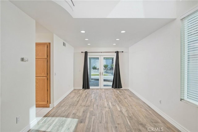 9788 Balaton St, Rancho Cucamonga, CA 91737 - spare room with light wood-style flooring, recessed lighting, and french doors