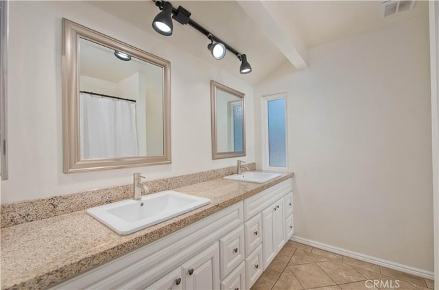 full bathroom featuring double vanity, tile patterned flooring, baseboards, and beam ceiling