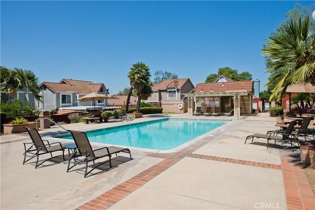 community pool with a patio area
