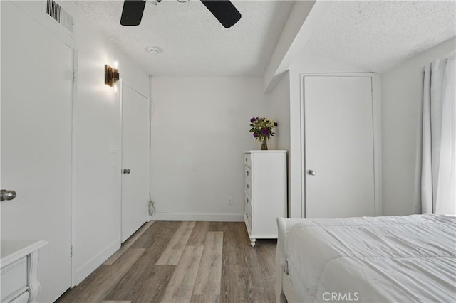 13722 Cerise Ave, Hawthorne, CA 90250 - bedroom with a textured ceiling, wood finished floors, a ceiling fan, and baseboards