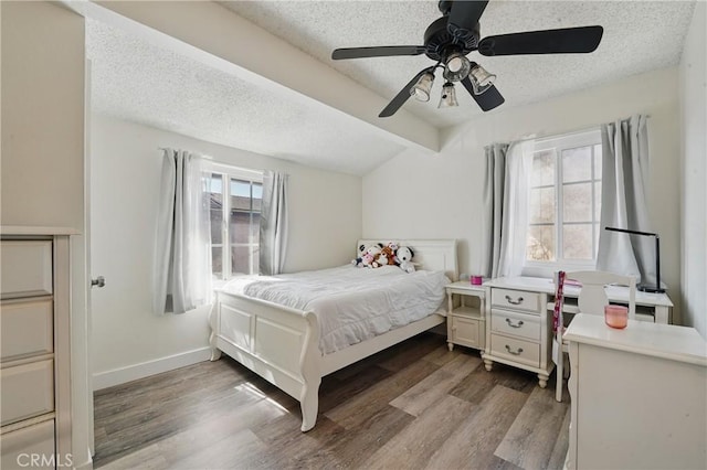 13722 Cerise Ave, Hawthorne, CA 90250 - bedroom featuring a textured ceiling, wood finished floors, ceiling fan, and baseboards