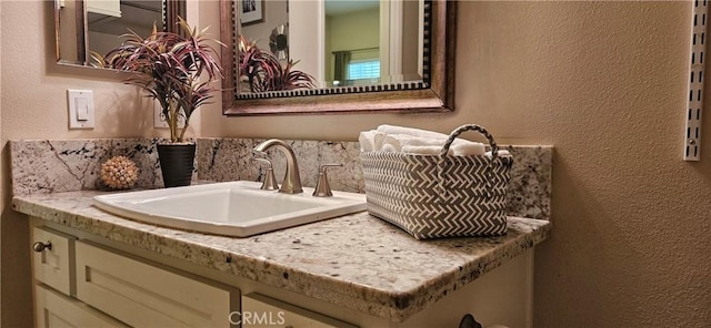 21218 Camelia Unit 49, Lake Forest, CA 92630 - bathroom with a textured wall and vanity