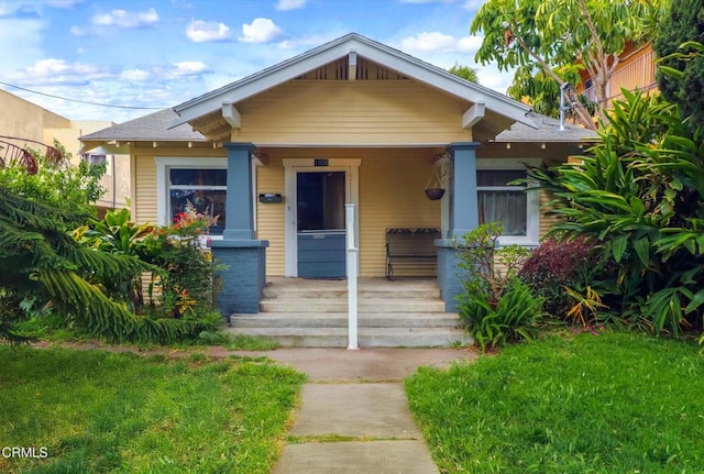 1035 Ohio Ave, Long Beach, CA 90804 - bungalow-style house with a porch and a front yard