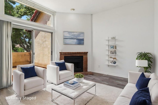 514 Jamacha Rd Unit 17, El Cajon, CA 92019 - living room featuring wood finished floors, a fireplace, and baseboards