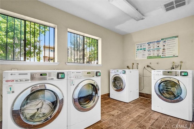 600 W 3rd St Unit A115, Santa Ana, CA 92701 - communal laundry room featuring washer and dryer and wood finished floors
