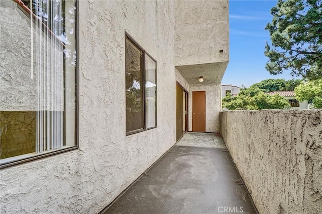 600 W 3rd St Unit A115, Santa Ana, CA 92701 - view of property exterior featuring stucco siding and a balcony