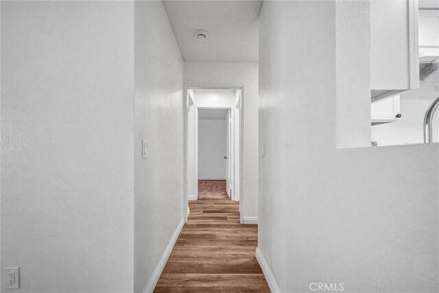600 W 3rd St Unit A115, Santa Ana, CA 92701 - hallway with wood finished floors and baseboards