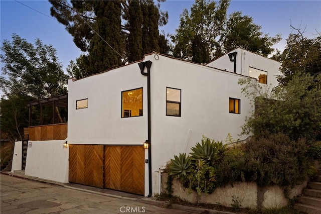 479 Crane Blvd, Los Angeles, CA 90065 - view of side of home with stucco siding and a garage
