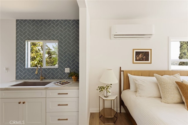 479 Crane Blvd, Los Angeles, CA 90065 - bedroom with a wall mounted AC, a sink, and wood finished floors