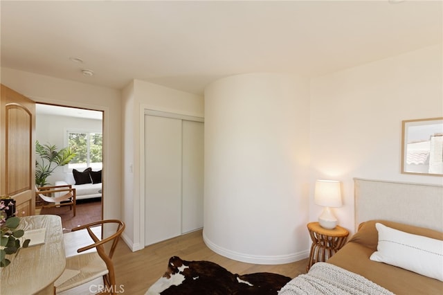 479 Crane Blvd, Los Angeles, CA 90065 - bedroom with light wood finished floors, a closet, and baseboards