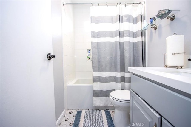 bathroom with toilet, vanity, shower / bath combination with curtain, and baseboards