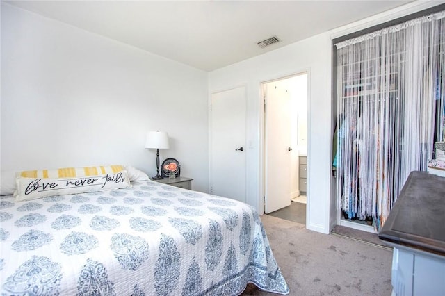 bedroom with carpet and baseboards