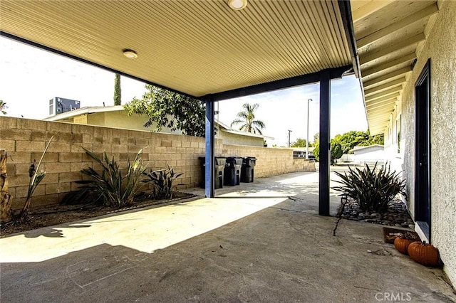 view of patio / terrace featuring fence
