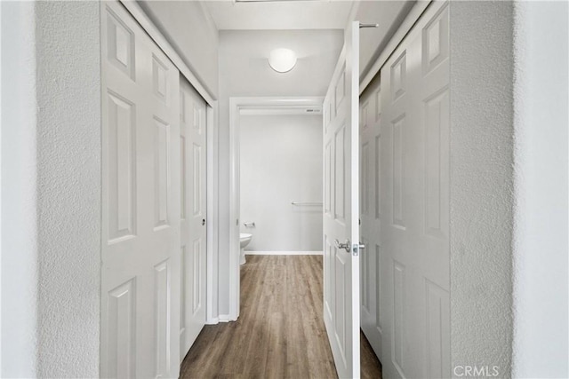 986 Coriander Dr Unit 304, Hemet, CA 92545 - hall featuring wood finished floors and baseboards