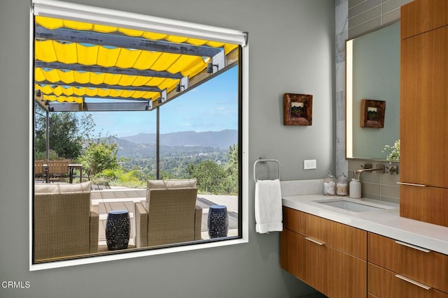 bathroom featuring a mountain view and vanity