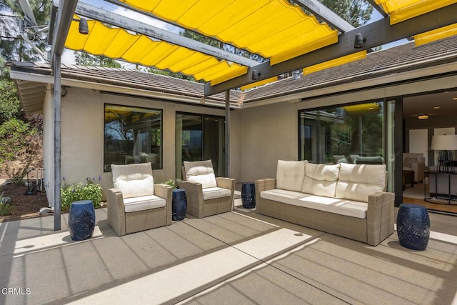 wooden terrace with a patio and an outdoor living space