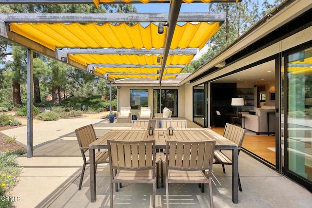 view of patio featuring outdoor dining area