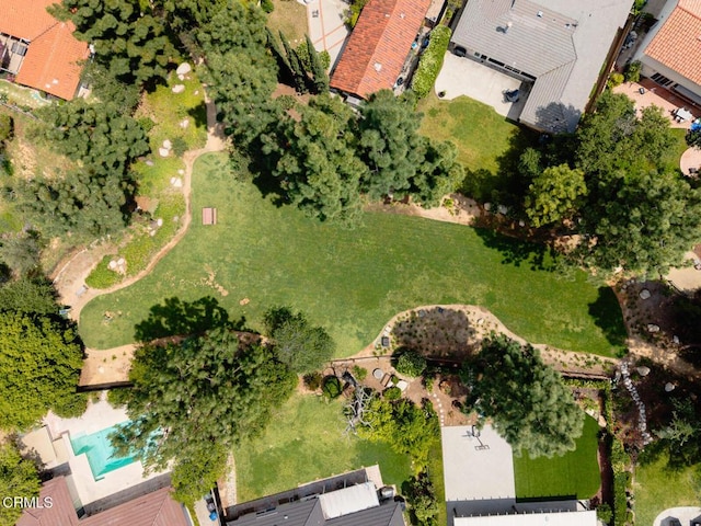 aerial view of property and surrounding area with a pool area