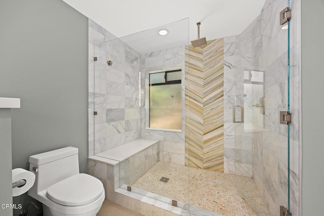 full bathroom featuring a shower stall, toilet, and recessed lighting