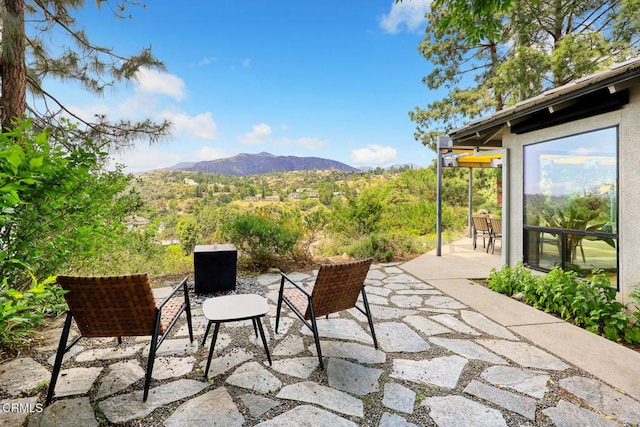 view of patio / terrace with a mountain view