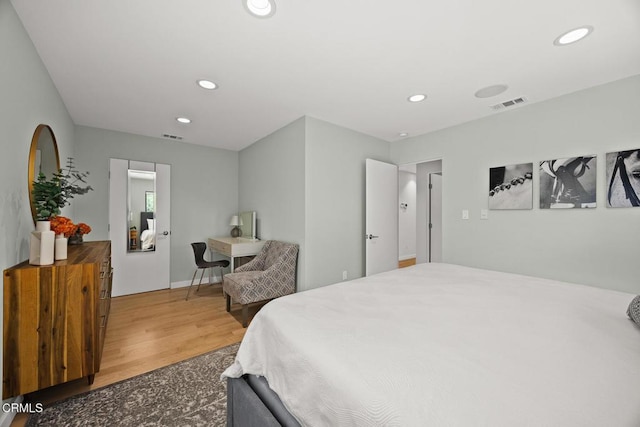 bedroom featuring recessed lighting and wood finished floors