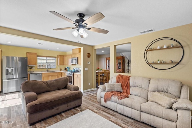 2024 Green Ridge Cir, Lompoc, CA 93436 - living room with ceiling fan, light wood-style floors, and baseboards