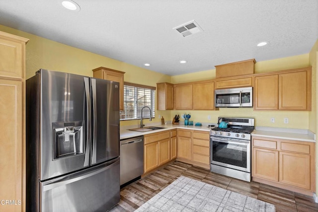 2024 Green Ridge Cir, Lompoc, CA 93436 - kitchen featuring appliances with stainless steel finishes, a sink, light brown cabinets, light countertops, and recessed lighting