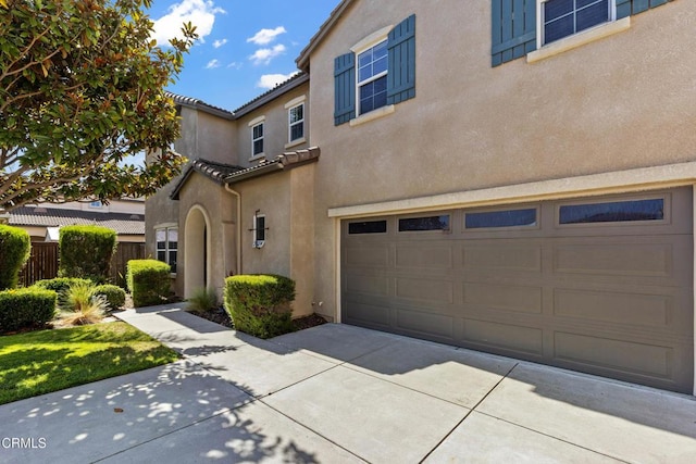 2024 Green Ridge Cir, Lompoc, CA 93436 - view of front facade featuring a garage, stucco siding, and a tile roof
