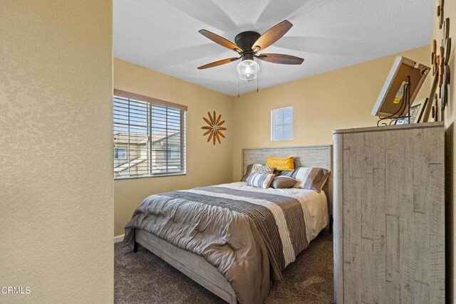2024 Green Ridge Cir, Lompoc, CA 93436 - carpeted bedroom featuring multiple windows, a ceiling fan, and a textured wall