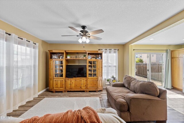 2024 Green Ridge Cir, Lompoc, CA 93436 - living area with healthy amount of natural light, ceiling fan, a textured ceiling, and wood finished floors